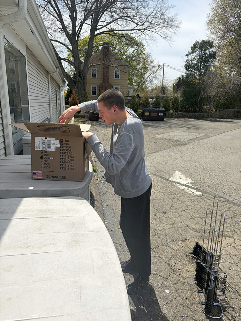 Jacob unboxing items.