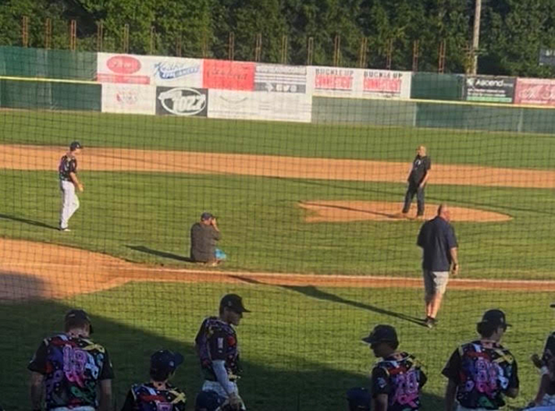 Screenshot Larry Fleming throwing out the first pitch